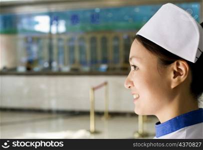 Side profile of a female nurse smiling