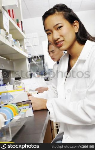 Side profile of a female pharmacist working in a laboratory