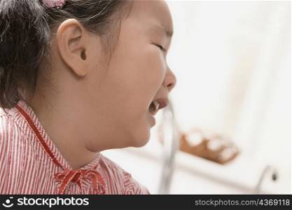 Side profile of a girl crying