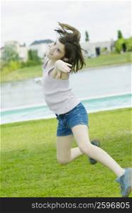 Side profile of a girl jumping