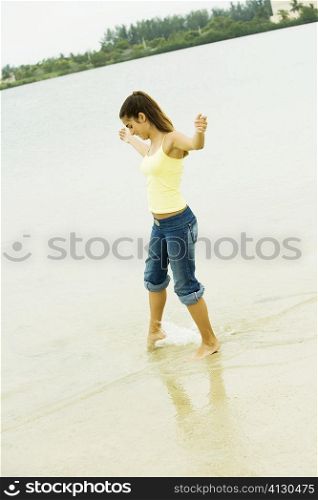 Side profile of a girl standing on the beach