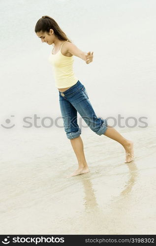 Side profile of a girl walking on the beach