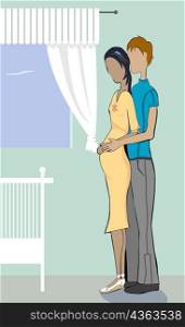 Side profile of a man embracing a pregnant woman