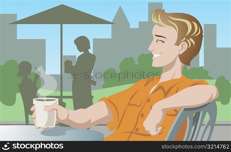 Side profile of a man holding a cup of coffee