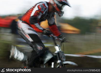 Side profile of a man on a racing bike