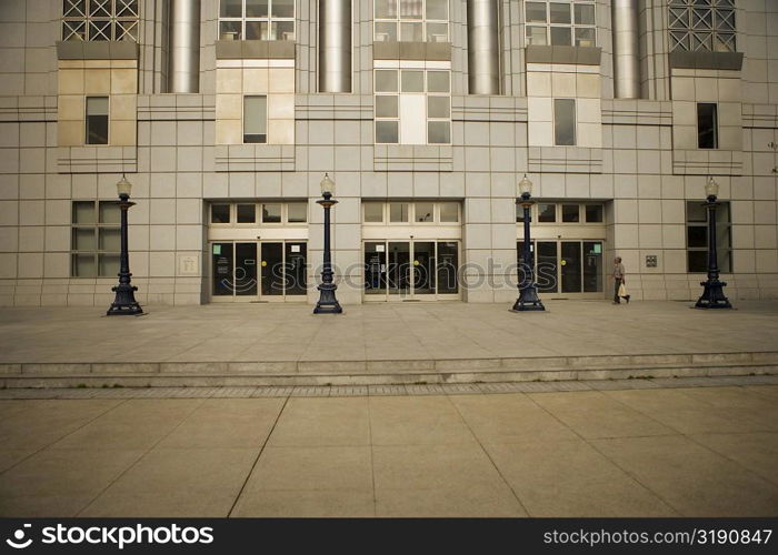 Side profile of a man walking in front of a building, San Francisco, California, USA