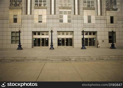 Side profile of a man walking in front of a building, San Francisco, California, USA