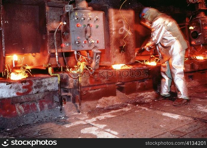 Side profile of a manual worker working in a steel plant