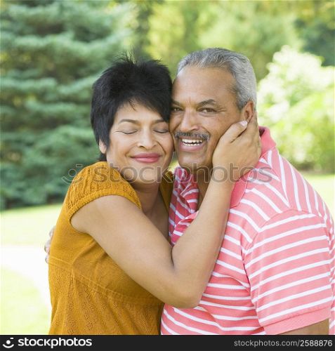 Side profile of a mature woman embracing a senior man