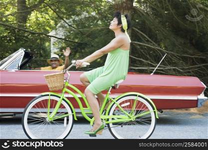 Side profile of a mature woman riding a bicycle