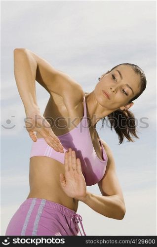 Side profile of a mid adult woman practicing martial arts