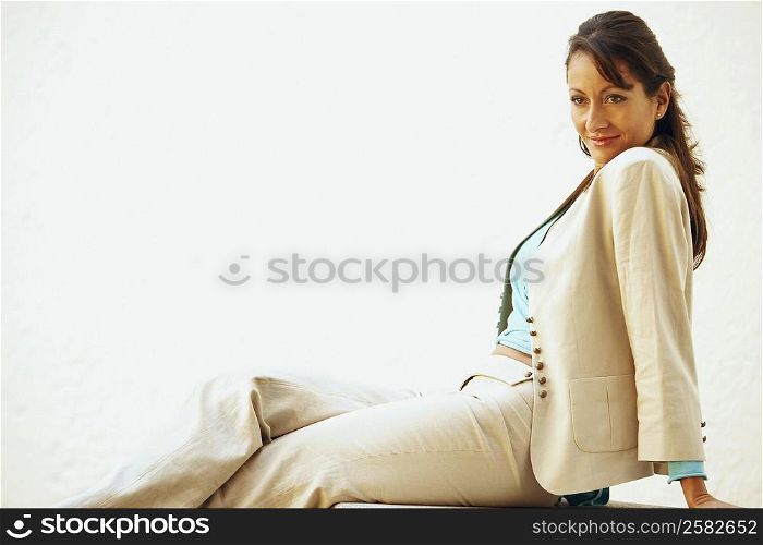 Side profile of a mid adult woman sitting on a seat
