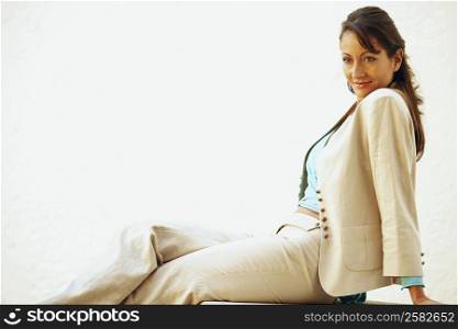 Side profile of a mid adult woman sitting on a seat