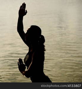 Side profile of a mid adult woman standing in water