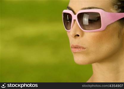 Side profile of a mid adult woman wearing sunglasses