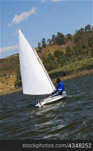Side profile of a person participating in a sailboat race