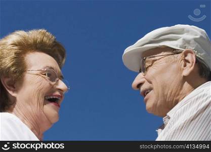 Side profile of a senior couple smiling