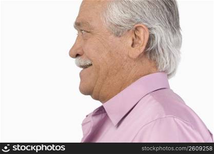 Side profile of a senior man smiling