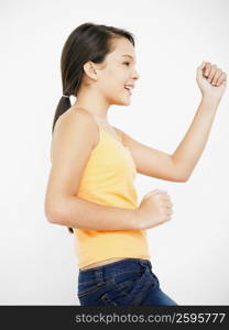 Side profile of a teenage girl dancing