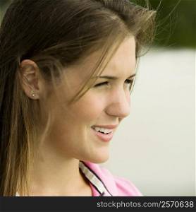 Side profile of a teenage girl smiling