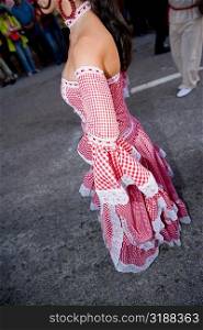 Side profile of a woman wearing a costume and performing