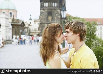 Side profile of a young couple face to face