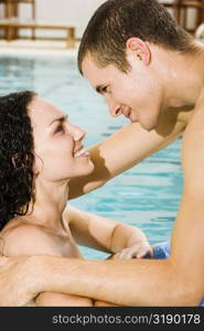 Side profile of a young couple in a swimming pool