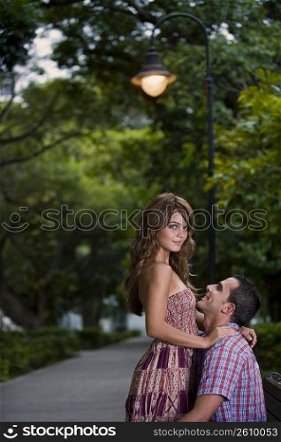 Side profile of a young couple romancing