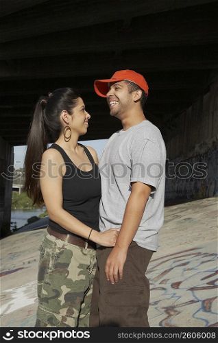 Side profile of a young couple smiling