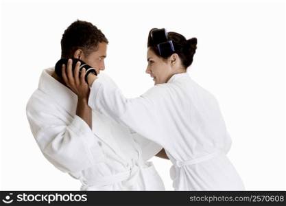Side profile of a young couple sparring