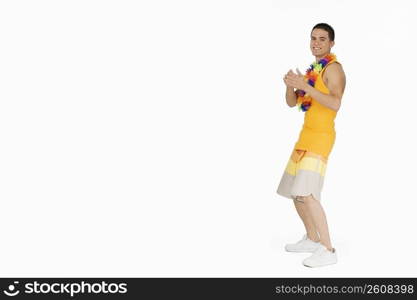 Side profile of a young man clapping