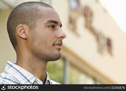 Side profile of a young man looking away