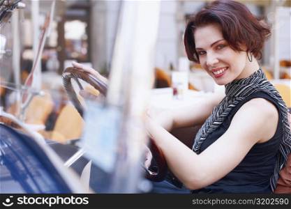 Side profile of a young woman in a car