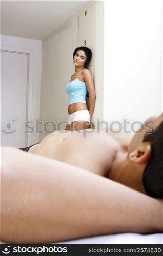 Side profile of a young woman looking at a young man