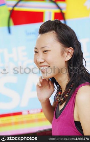 Side profile of a young woman smiling