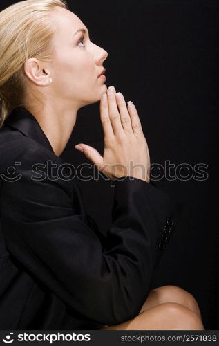 Side profile of a young woman thinking