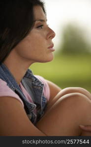 Side profile of a young woman thinking