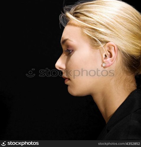 Side profile of a young woman thinking