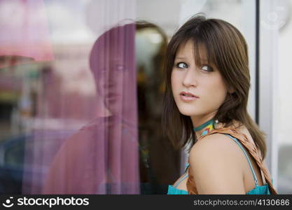 Side profile of a young woman window shopping