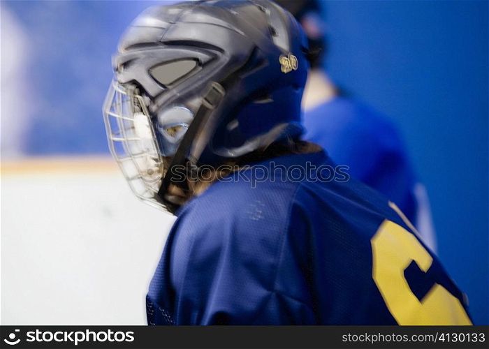 Side profile of an ice hockey player wearing a helmet