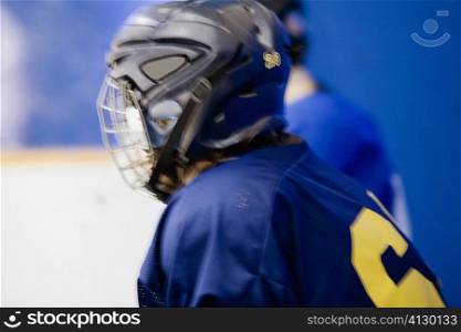 Side profile of an ice hockey player wearing a helmet