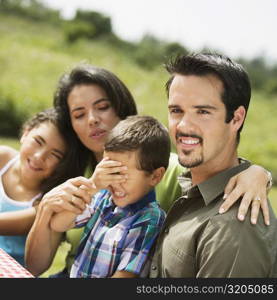 Side profile of parents and their two children