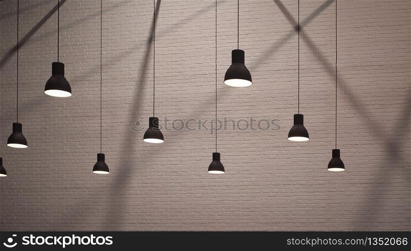 Side view and selective focus of vintage hanging lamps with light and shadow on surface of brick wall background in monochrome style, interior architecture design concept