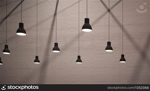 Side view and selective focus of vintage hanging lamps with light and shadow on surface of brick wall background in monochrome style, interior architecture design concept