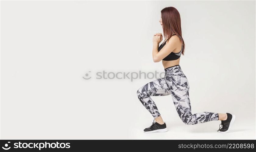 side view athletic woman doing lunges