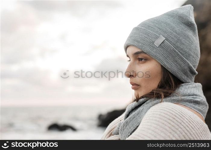 side view beautiful woman posing beach with copy space