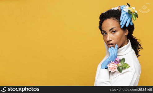 side view beautiful woman posing with floral gloves copy space