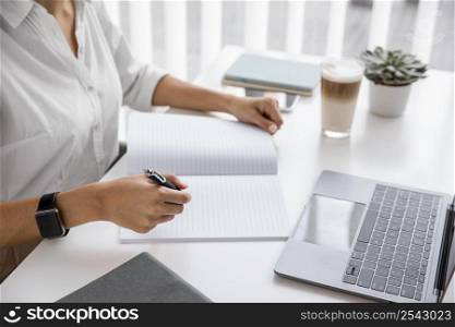 side view businesswoman working with notebook laptop