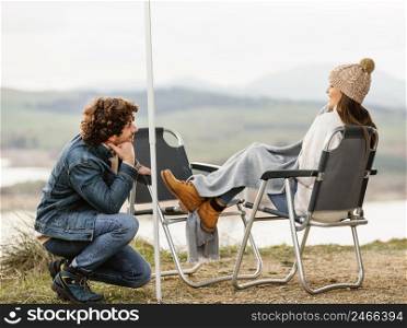 side view couple enjoying nature while road trip together