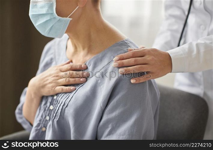 side view covid recovery center female doctor checking elder patient. Resolution and high quality beautiful photo. side view covid recovery center female doctor checking elder patient. High quality beautiful photo concept